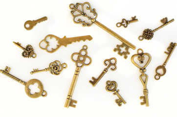 Decorative keys of different sizes, stylized antique on a white background. Form the centerpiece.