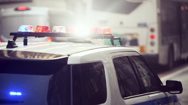 Police car with alarm and signal light flashes on the roof rush emergency call in New York City
