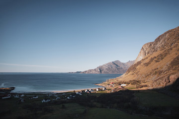 Fjord in Norway near Tromso in autumn. Calm sunny weather with long shadows.