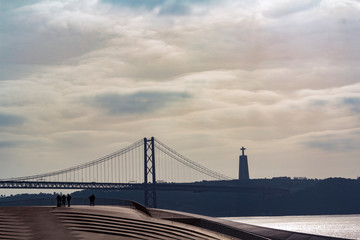Lisbon landscape with bridge under river and Christ the King