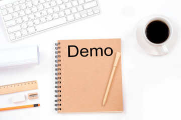 Demo word with modern workplace on white background.