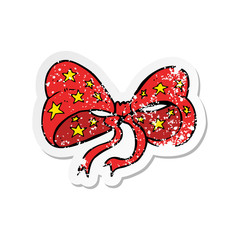 retro distressed sticker of a cartoon bow tie