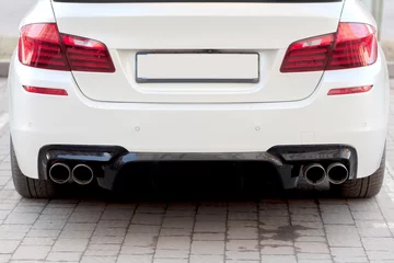Deurstickers Close up of a car dual exhaust pipe © volody10