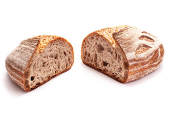 Whole wheat sourdough freshly baked bread on white background.