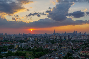 Naklejka premium Silhouette shot of downtown Kuala Lumpur skyline at twilight in Malaysia