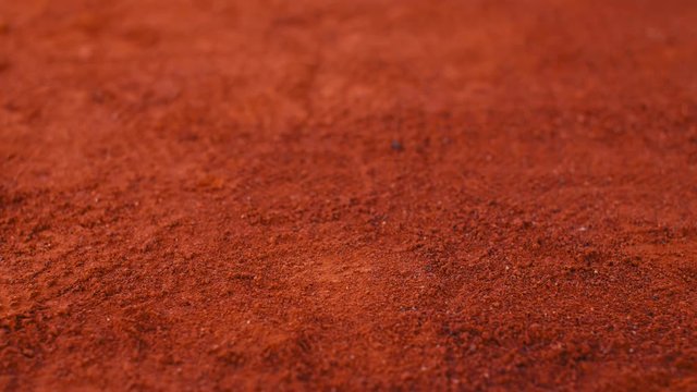 Balls bouncing on orange clay tennis court.Slow Motion 75fps