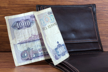 old money and brown leather wallet