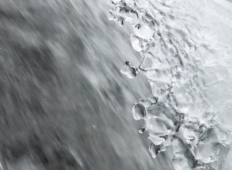 Fragment of the waterfall in winter.