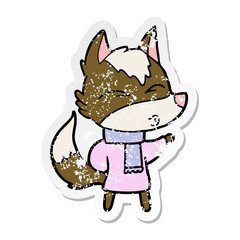 Obraz na płótnie Canvas distressed sticker of a cartoon wolf in winter clothes