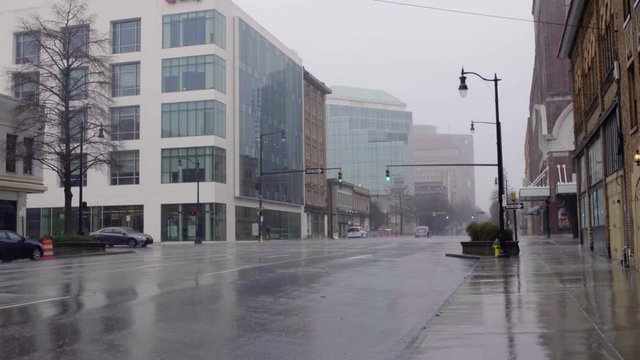 Rain falls on the streets of downtown Birmingham during a winter storm