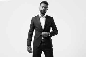 Brutal young African American male model in formal fashion suit