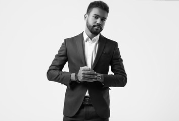 Brutal young African American male model in formal fashion suit