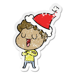 laughing distressed sticker cartoon of a man wearing santa hat