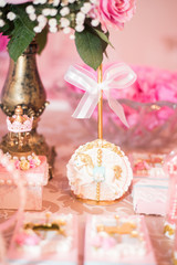 Fototapeta na wymiar Sweets and table decoration - Carousel theme - Children's birthday