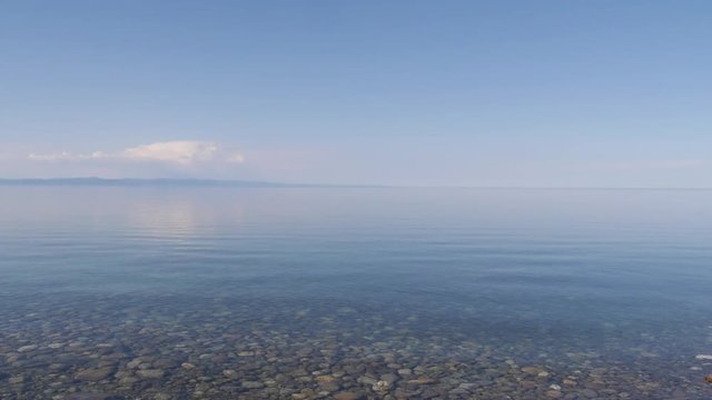 Blue calm waves on lake