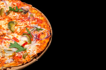 Pizza on a wood board on a black background