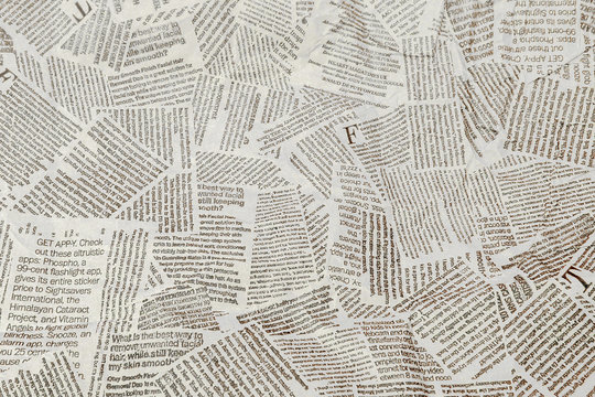 Black and white repeating torn newspaper background. Continuous pattern left, right, up and down