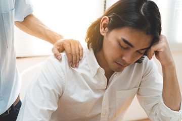 Person touching shoulder friend to encouragement.