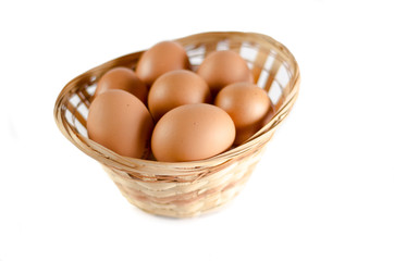 Brown chicken eggs in a basket