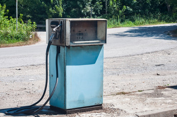 Old abandoned vintage obsolete petrol fuel gas dispenser in former petrol station