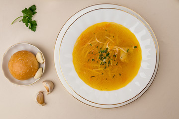 Chicken soup bouillon in a plate