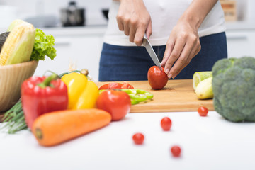 Close up woman preparing ingredient for salad.