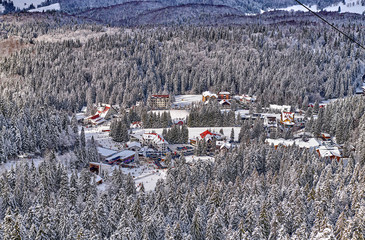 Panoramic view over the ski slope Poiana Brasov ski resort in Transylvania