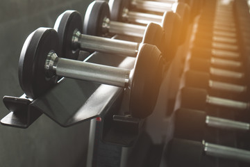 Obraz na płótnie Canvas dumbbells on the rack in gym.