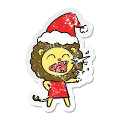 distressed sticker cartoon of a roaring lion girl wearing santa hat