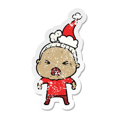 distressed sticker cartoon of a angry old woman wearing santa hat