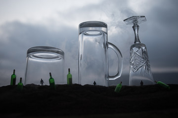Iron handcuffs for the arrest of criminals, a glass of vodka on a wooden. background. a crime...