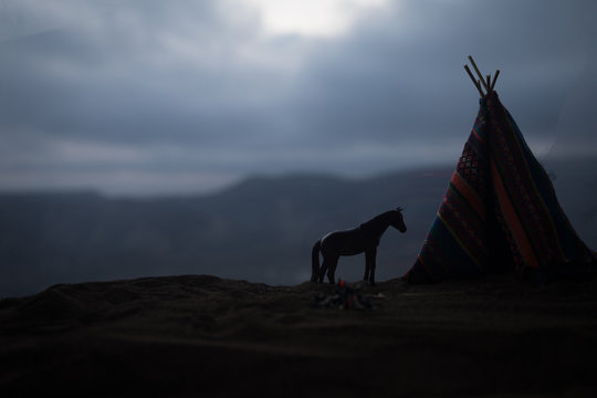 An old native american teepee in the desert - Powered by Adobe