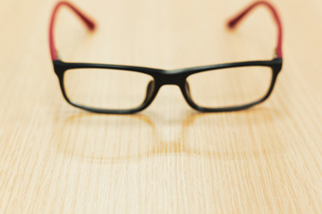 eyeglasses on wooden table office