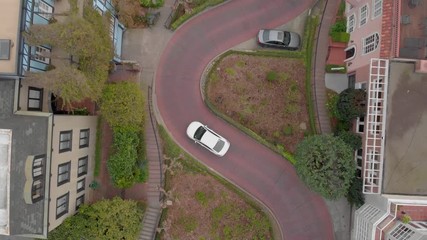 Cars driving on Lombard Street curves in San Francisco