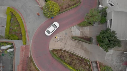 Cars driving on Lombard Street curves in San Francisco