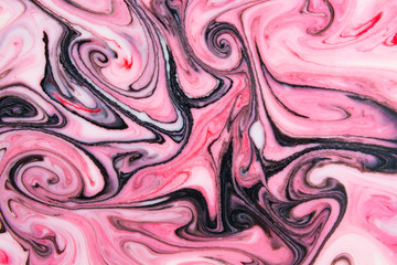 Abstract beautiful pattern of pink and black marble.The Eastern style of Ebru painting on water with acrylic paints swirls marbling.A stylish mix of colors,genuine luxury 