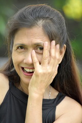 Senior Minority Adult Female And Shyness