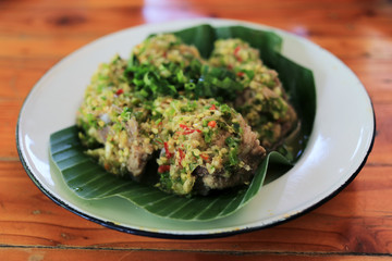 Thai spicy dry soup with pork ribs, chili, coriander (Leng soup, Leng Zap). 