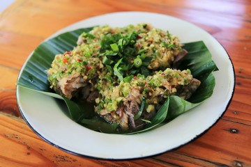 Thai spicy dry soup with pork ribs, chili, coriander (Leng soup, Leng Zap). 