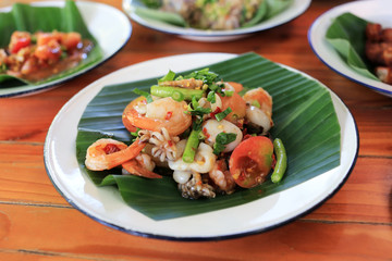 Fototapeta na wymiar Seafood papaya spicy salad Thai traditional food “Som Tum” 