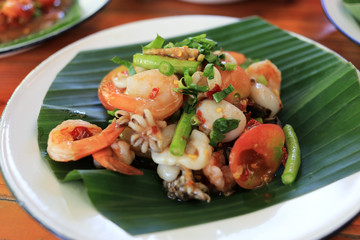 Seafood papaya spicy salad Thai traditional food “Som Tum” 