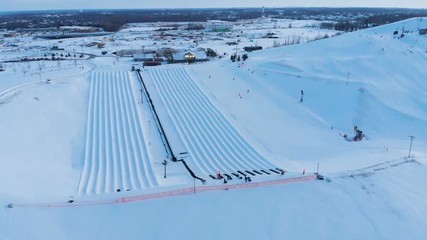 Snow park in Wisconsin, winter activities (tubing, skiing, snowboarding). Drone shots , bird's eyes view