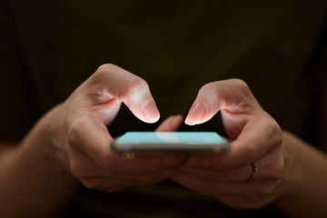 Holding hand on mobile phone