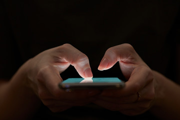 Holding hand on mobile phone