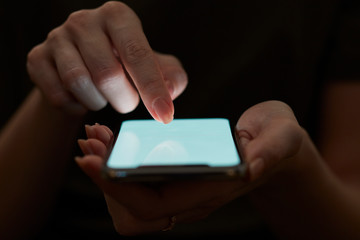 Holding hand on mobile phone