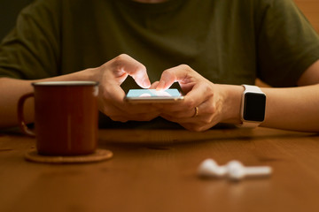 Holding hand on mobile phone