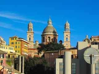 Fototapeta premium Renaissance church Santa Maria Assunta surrounded by city Genoa, Italy
