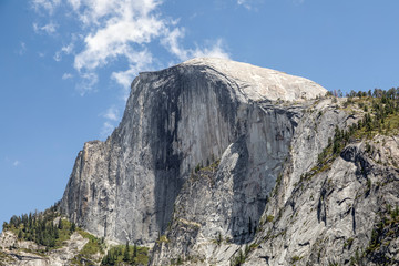 Half Dome Northwest Face - The iconic Half Dome summit rises majestically over 4700 feet above the Yosemite Valley of California’s Sierra Nevada Mountain Range.