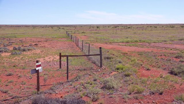 A dog fence keeps wild dogs from agricultural fields near Coober Pedy, outback Australia.