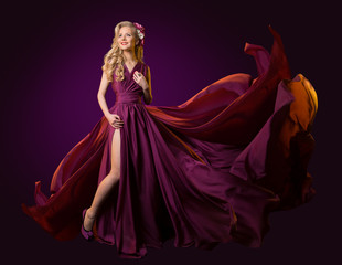 Woman Flying Purple Dress, Fashion Model Dancing in Long Waving Gown, Fluttering Fabric on Wind